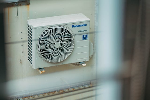 HVAC machine on side of building
