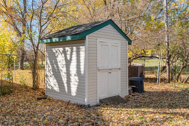 an outdoor shed surrounded by fall foliage