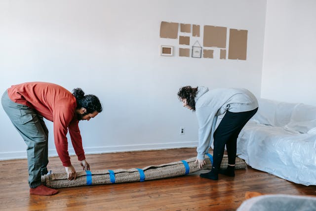 Person replacing a carpet