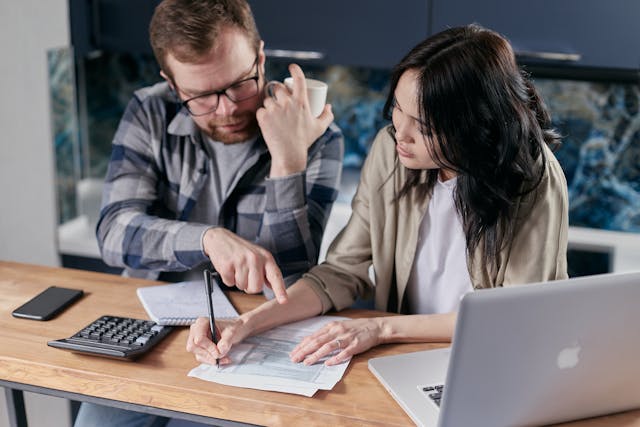 two people doing calculations