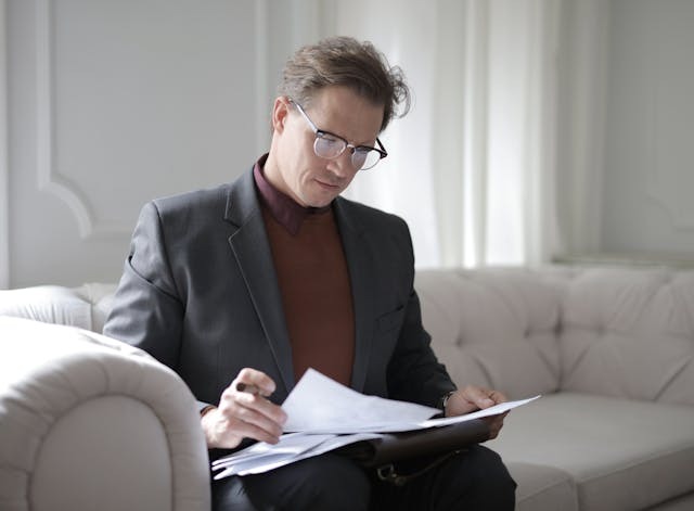 person reading through documents