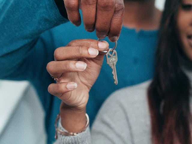 two people holding keys up