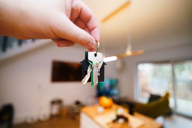 person holding up a set of keys